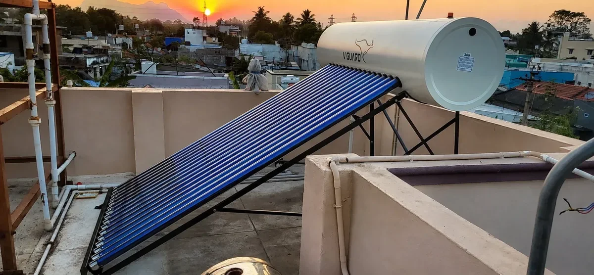 V-Guard TRU HOT PRO 300L solar water heater installed Coimbatore rooftop at golden sunset